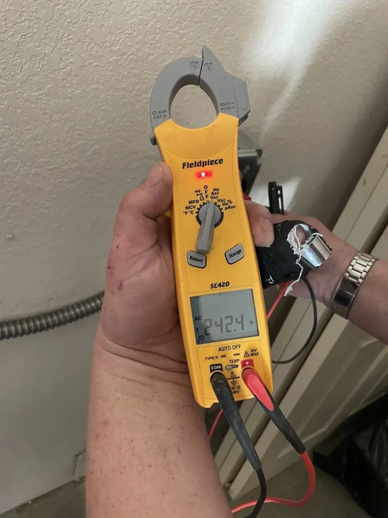 Voltage testing with clamp meter during Ceiling Fan Installation in Midway South